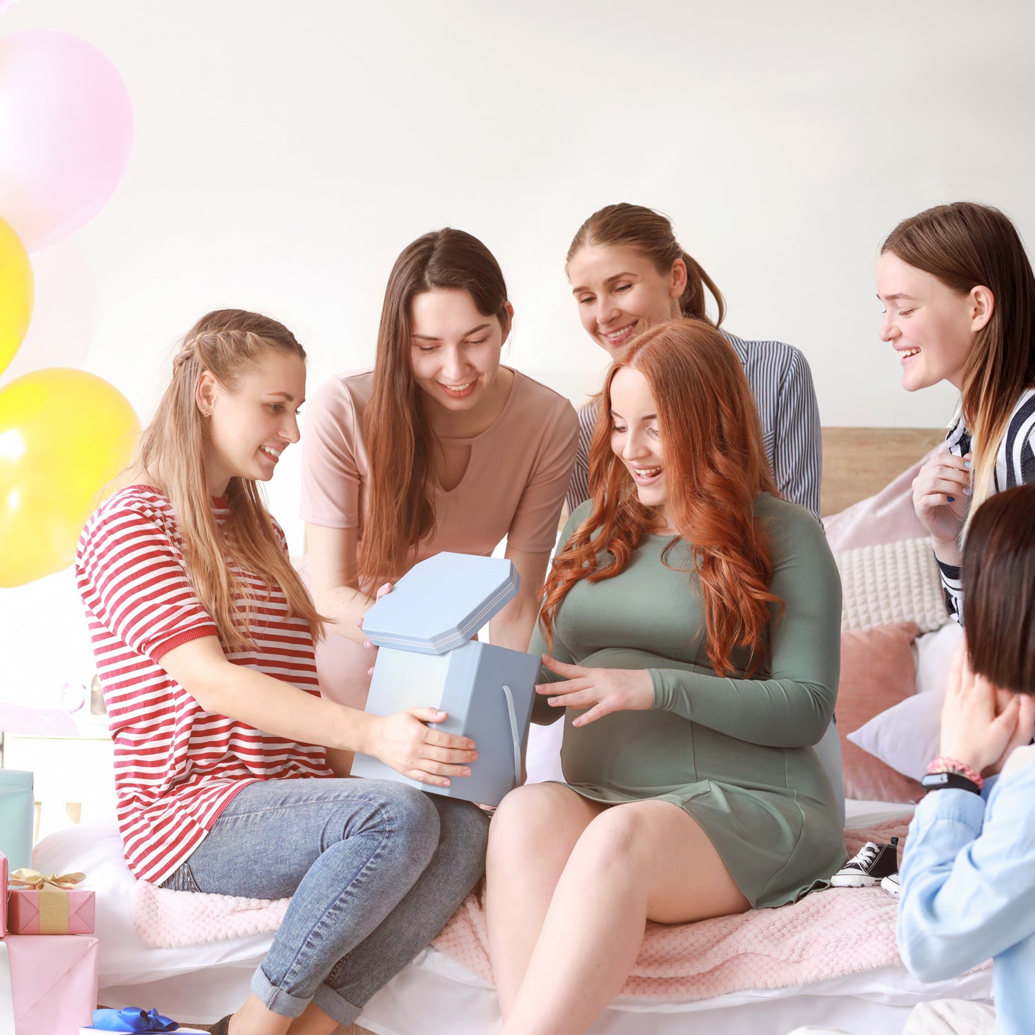 women playing baby shower games