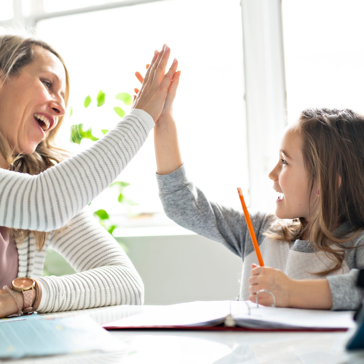 girl doing Downloadable Printable Sight Words Worksheets with mom