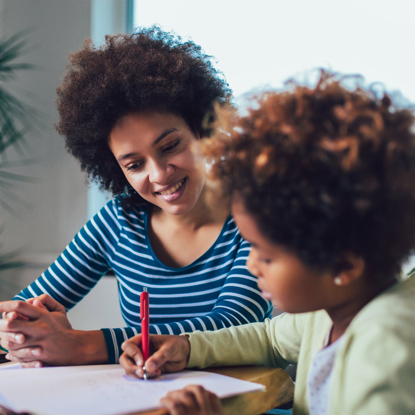 mom and daughter completing Downloadable Printable Math Addition Worksheets